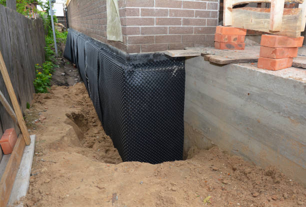 Happy homeowners after waterproofing job in Petros